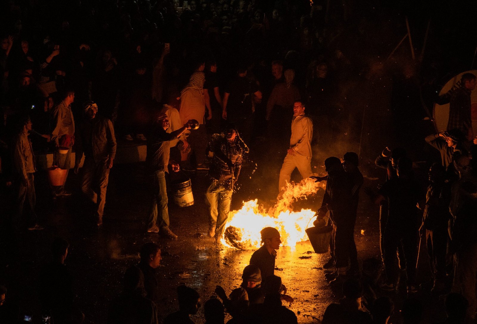 People gathered around a fire.